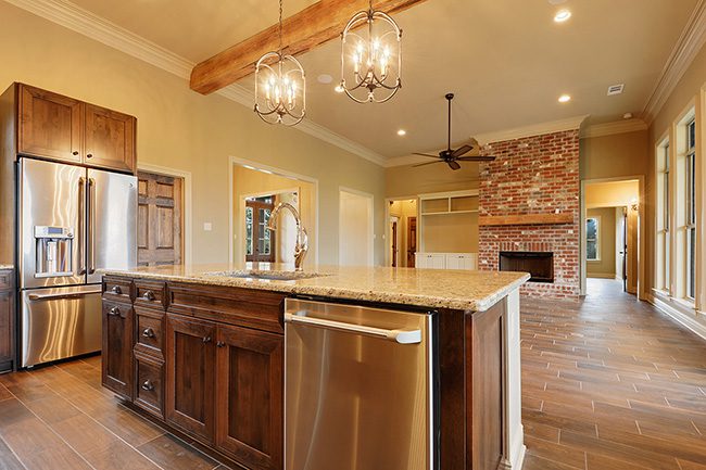 Large kitchen island with granite countertops.