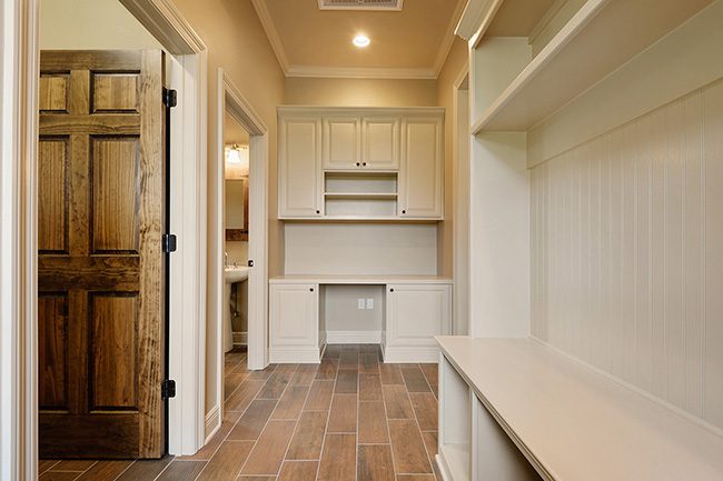 Custom mudroom and office nook with recessed lighting.