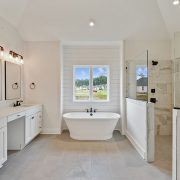 Simple modern design in this master bathroom. Featuring a huge walk in shower.