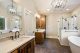 A primary bathroom featuring a nice soaking tub and luxurious shower.