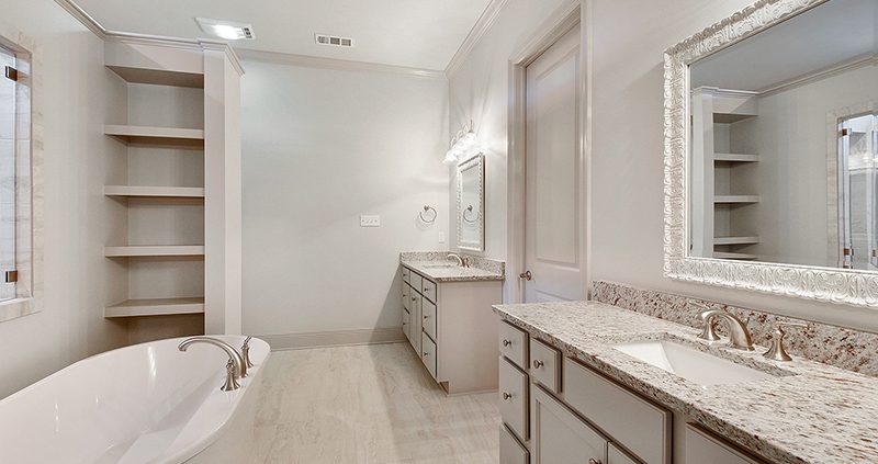 The master bathroom features a nice soaking tub with a dual vanity.