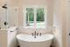This bathroom features a stand alone soaking tub.