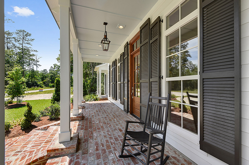 Shaded front porch that is a great place` to sit and enjoy the Louisiana weather.