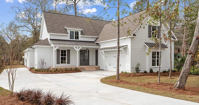 A side entry garage is perfect for this nice farmhouse look home.