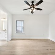 A modern ceiling fan adds a stylish finishing touch, making it a versatile space for relaxation or work.