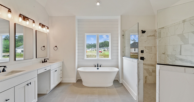 Simple modern design in this master bathroom. Featuring a huge walk in shower.