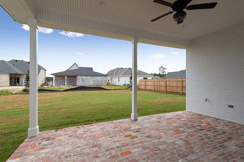 This Covered Back Porch Has A Lighted Ceiling Fan And A Nice Custom Brick Floor.