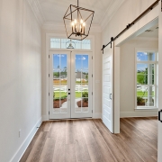 A nice foyer with double entry doors.
