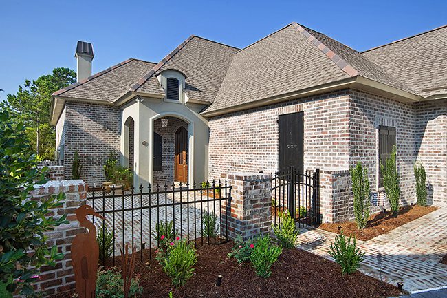 This courtyard home features all brick exterior and a nice private entry.
