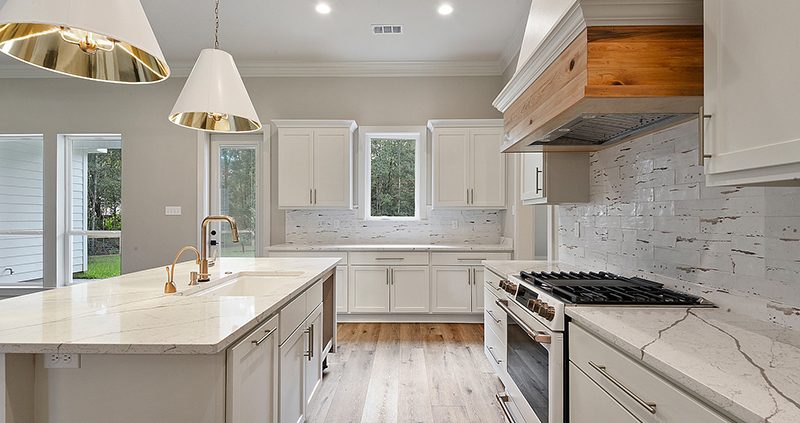 Custom home with a custom hood in the kitchen.