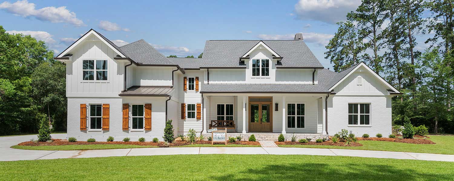 A “SOLD” sign from Ron Lee Custom Homes marks it as a dream home already claimed.